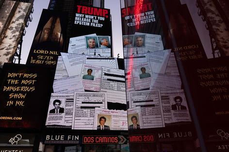 NEW YORK, NEW YORK - JULY 23: A billboard in Times Square calls for the release of the Epstein files on July 23, 2025 in New York City.  Attorney General Pam Bondi briefed President Donald Trump in May on the Justice Department's review of the documents related to the Jeffrey Epstein case, telling him that his name appeared in the files. (Photo by Adam Gray/Getty Images)