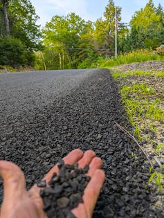 This rural road near my house was just coated with small stone chips embedded in a thin layer of asphalt cement. You can do the same thing on your driveway. (Tim Carter/Tribune Content Agency/TNS)
