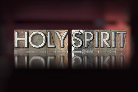The words Holy Spirit written in vintage letterpress type. Dreamstime/TCA