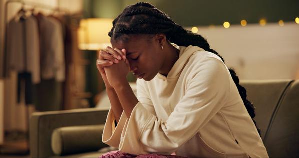 Woman praying. Dreamstime/TCA