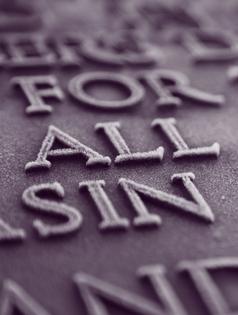 The words FOR ALL SIN coated in frost on a plaque. Dreamstime/TCA