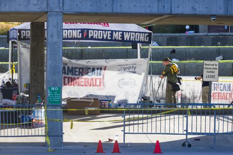 FBI agents walk through the courtyard at Utah Valley University as authorities search for the man who killed political activist Charlie Kirk on Sept. 11, 2025 in Orem, Utah. Kirk, founder of Turning Point USA, was speaking at his “American Comeback Tour” when he was shot in the neck and killed. (Michael Ciaglo/Getty Images/TCA)