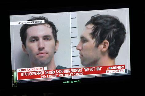 A TV monitor displays a picture of Tyler Robinson, the suspected of killing Charlie Kirk on September 11, in Orem, Utah, on September 12, 2025. US President Donald Trump on Friday announced that the suspect had been taken into custody over the killing of right-wing activist Charlie Kirk after a massive manhunt. (Photo by Patrick T. Fallon / AFP) (Photo by PATRICK T. FALLON/AFP via Getty Images)
