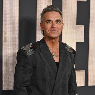 Bang Showbiz / Robbie Williams has delayed the release of his album Britpop