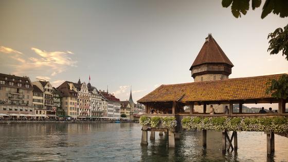 Covered and filled with paintings, Lucerne’s Chapel Bridge zigzags its way across the Reuss River. (Dominic Arizona Bonuccelli, Rick Steves’ Europe)