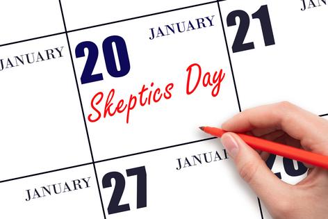 Hand writing text Skeptics Day on calendar date. Dreamstime/TCA