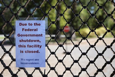 A sign on the entrance to the U.S. National Arboretum is seen as it is closed due to the federal government shut down on Wednesday, Oct. 1, 2025, in Washington, D.C. The government shut down early Wednesday after Congress failed to reach a funding deal. (Kevin Dietsch/Getty Images/TNS)