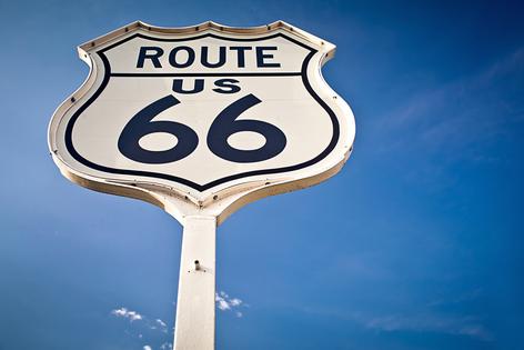 Route 66 sign on blue sky background. Dreamstime/TCA
