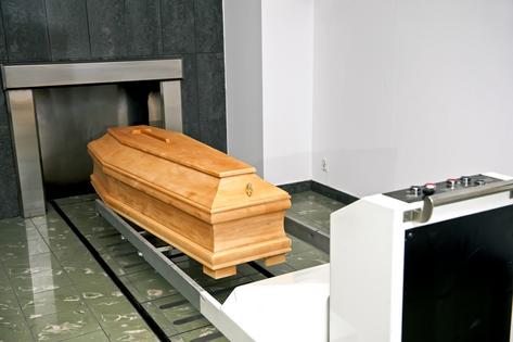 A wooden coffin in a contemporary crematory. Funeral service. Dreamstime/TCA