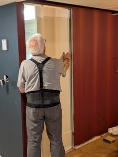 I’m checking a new pocket door in my son’s basement to ensure it glides in and out of the pocket. There are many reasons you should consider several of these doors in your home. (Tim Carter/Tribune Content Agency/TNS)