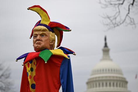 An effigy of US President Donald Trump dressed as a jester is seen as people protest against the administration's decision to virtually shut down the United States Agency for International Development (USAID) at the US Capitol in Washington, D.C., on Feb. 5, 2025. (Drew Angerer/AFP via Getty Images/TNS)