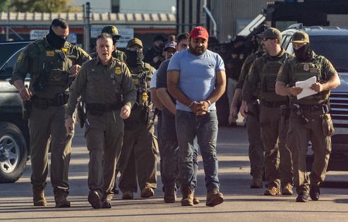 U.S. Border Patrol chief Greg Bovino leads detainees into the Immigration and Customs Enforcement holding facility in Broadview, Illinois, on Sept. 27, 2025. (Dominic Di Palermo/Chicago Tribune/TNS)