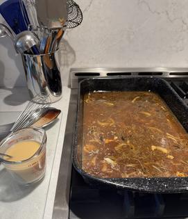 The drip pan beneath the roasted turkey holds concentrated flavor and forms the foundation for superior gravy. (JeanMarie Brownson/TCA)