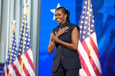 CHICAGO, ILLINOIS - AUGUST 20: Former first lady Michelle Obama arrives to speak on stage during the second day of the Democratic National Convention at the United Center on August 20, 2024 in Chicago, Illinois. Delegates, politicians, and Democratic Party supporters are gathering in Chicago, as current Vice President Kamala Harris is named her party's presidential nominee. The DNC takes place from August 19-22. (Photo by Andrew Harnik/Getty Images)