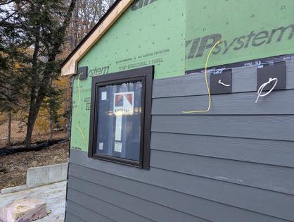 The siding on this house is being applied directly over the wood sheathing. The sheathing has a plastic covering, and tape is required to prevent water from infiltrating into the wall cavity. (Tim Carter/Tribune Content Agency)