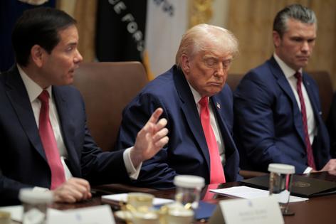 U.S. Secretary of State Marco Rubio (L) speaks during a Cabinet meeting alongside U.S. President Donald Trump and U.S. Secretary of War Pete Hegseth in the Cabinet Room of the White House on Dec. 2, 2025 in Washington, D.C. (Chip Somodevilla/Getty Images/TCA)