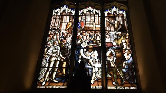 A dramatic stained-glass window at St. Giles’ Cathedral depicts John Knox in the middle of one of his many fiery sermons. (Cameron Hewitt, Rick Steves’ Europe)