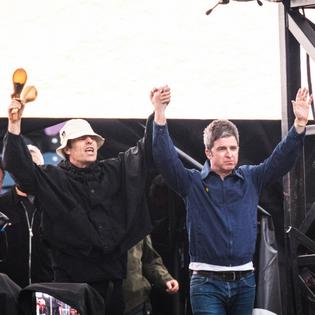 Bang Showbiz / Oasis stars Liam Gallagher and Noel Gallagher on stage at Murrayfield Stadium in Edinburgh