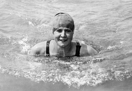 American Olympic gold medalist, swimmer Gertrude Ederle (1905 - 2003) poses in the sea at Brighton, training for her cross English Channel swim, July 2, 1925. (Photo by Topical Press Agency/Getty Images)