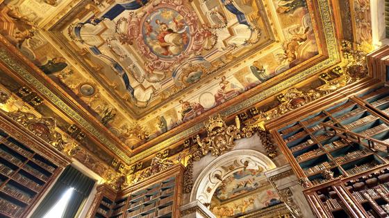 The painted ceiling of King João’s Library at Portugal’s University of Coimbra is an example of the Baroque illusion technique called trompe l’oeil. (Dominic Arizonia Bonuccelli, Rick Steves’ Europe)