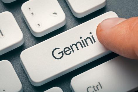 Close up photo of male hand finger pressing Gemini key on keyboard. New AI model of Google which understands text, images, video and speech. Dreamstime/TCA