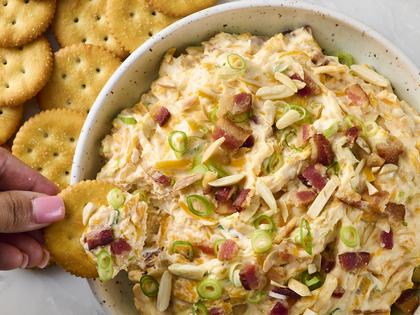 A creamy, cheesy dip loaded with bacon, toasted almonds, and a hint of spice, perfect for parties or snacking. (Alex Lepe /TCA)
