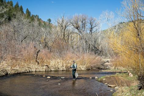 Snowpack has a direct impact on Colorado’s summer tourism, including fishing.
              UCG/Getty Images