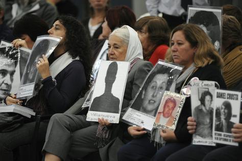 Argentines hold images of disappeared people in Buenos Aires during the trial of Argentina’s last dictator in 2010.
Rolando Andrade Stracuzzi Source/AP