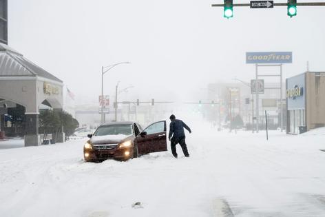 If you plan to drive in a winter storm, be prepared to be stranded, as this driver was in Little Rock, Ark., on Jan. 24, 2026. Cars can slide off roads, slide into each other or get stuck in snow drifts. Having warm winter gear, boots and a charged cell phone can help you deal with the cold.
              Will Newton/Getty Images