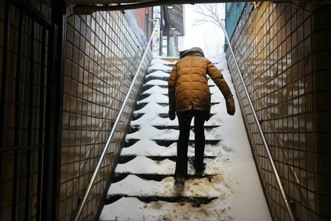 Walk carefully on snow and ice, particularly stairs like these in a New York subway station on Jan. 25, 2026. At home, be sure to clear snow off your steps soon after a storm so ice doesn’t build up.
              Spencer Platt/Getty Images