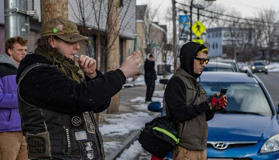 Members of the public take videos and blow whistles at what they think are Immigration and Customs Enforcement agents in unmarked cars driving by in South Portland, Maine, on Jan. 23, 2026.
              Joseph Prezioso/AFP via Getty Images