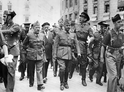 Gen. Francisco Franco, center, commander in the south, visits the headquarters of the northern front in Burgos, Spain, on Aug. 19, 1936, during the country’s civil war.
Imagno/Getty Images