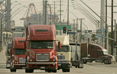 Trucks leave a smoggy Port of Long Beach in 2008, the year before the endangerment finding was released. Luis Sinco/Los Angeles Times via Getty Images