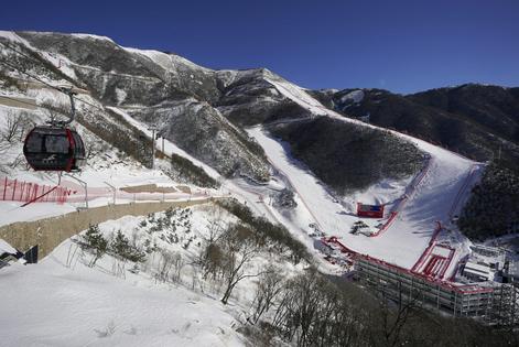 The finish area of the Alpine ski venue at the 2022 Winter Olympics was white because of machine-made snow.
              AP Photo/Robert F. Bukaty