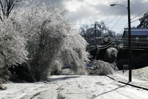 During winter storms, physical damage to wires and high demand for heating put pressure on the electrical grid. Brett Carlsen/Getty Images