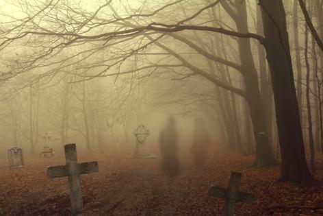 Ghosts in graveyard. Dreamstime/TCA