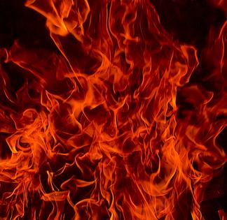 Red Fire Flames of Hell against a black background. Dreamstime/TCA