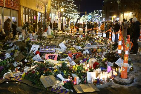 People visit a makeshift memorial for Alex Pretti in Minneapolis on Jan. 30, 2026.
Charly Triballeau/AFP via Getty Images