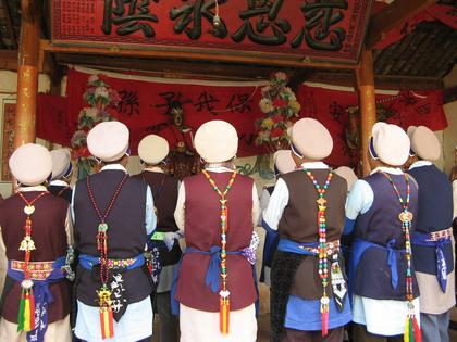 Women reciting scriptures together while facing a statue of their main temple’s deity in southwest China.
              Megan Bryson, CC BY