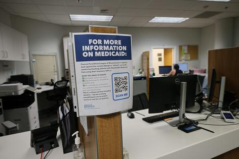 A sign for more information about Medicaid is set up in the patient waiting area in the Greater Boston Health Center at Planned Parenthood League of Massachusetts on July 23, 2025.
              Suzanne Kreiter/The Boston Globe via Getty Images