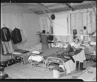 Japanese Americans incarcerated at assembly centers were quartered in rough barracks.
              Clem Albers, War Relocation Authority, Department of the Interior via National Archives and Records Administration
