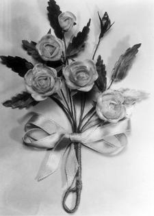 Peggy Nishimura Yorita composed the flowers and leaves in this corsage pin from shells she found at the Tule Lake concentration camp.
              Courtesy of the Bain Family Collection via Densho Digital Repository