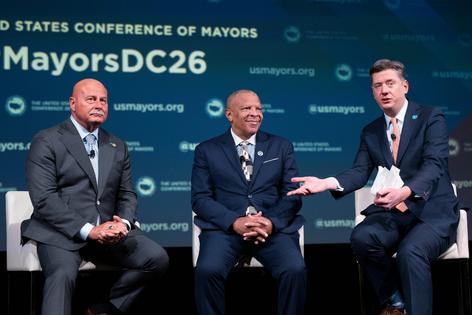 When mayors come together, they often find they face common problems in their cities. Gathered here, from left, are Jerry Dyer of Fresno, Calif., John Ewing Jr. of Omaha, Neb., and David Holt of Oklahoma City.
              AP Photo/Kevin Wolf