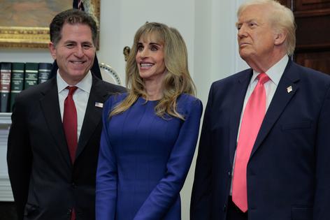 Tech billionaires Michael Dell (left) and Susan Dell join U.S. President Donald Trump to make an announcement about 