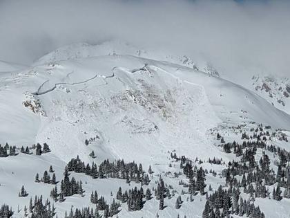 An avalanche takes down the side of a mountain near Winter Park, Colo., in 2021.
Colorado Avalanche Information Center via AP