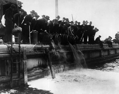 Prohibition agents dump beer into Lake Michigan in Chicago on Oct. 9, 1919.
              Bettmann/Getty Images