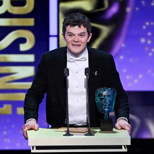 Bang Showbiz / Robert Aramayo accepting the EE BAFTA Rising Star Award at the 2026 EE BAFTA Film Awards
