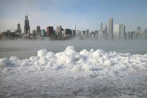 Water vapor rising from the surface of Lake Michigan condenses into droplets  on a sub-zero day, Jan. 6, 2014. Scott Olson/Getty Images