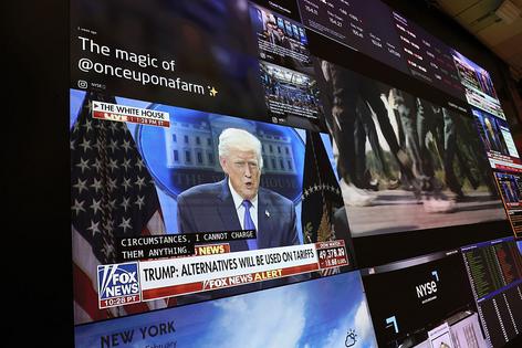 NEW YORK, NEW YORK - FEBRUARY 20: A press conference by U.S. President Donald Trump on tariffs is displayed on a television as traders work on the floor of the New York Stock Exchange during afternoon trading on February 20, 2026 in New York City. Stocks opened up mixed with the Dow Jones nearly 200 points at opening amid a weak gross domestic product for the fourth quarter. The Supreme Court ruled 6-3 on a decision against President Donald Trump’s tariffs. (Photo by Michael M. Santiago/Getty Images)