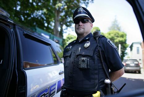A police officer in Ipswich, Mass., wears a WatchGuard body camera on July 29, 2020. Jonathan Wiggs/The Boston Globe via Getty Images